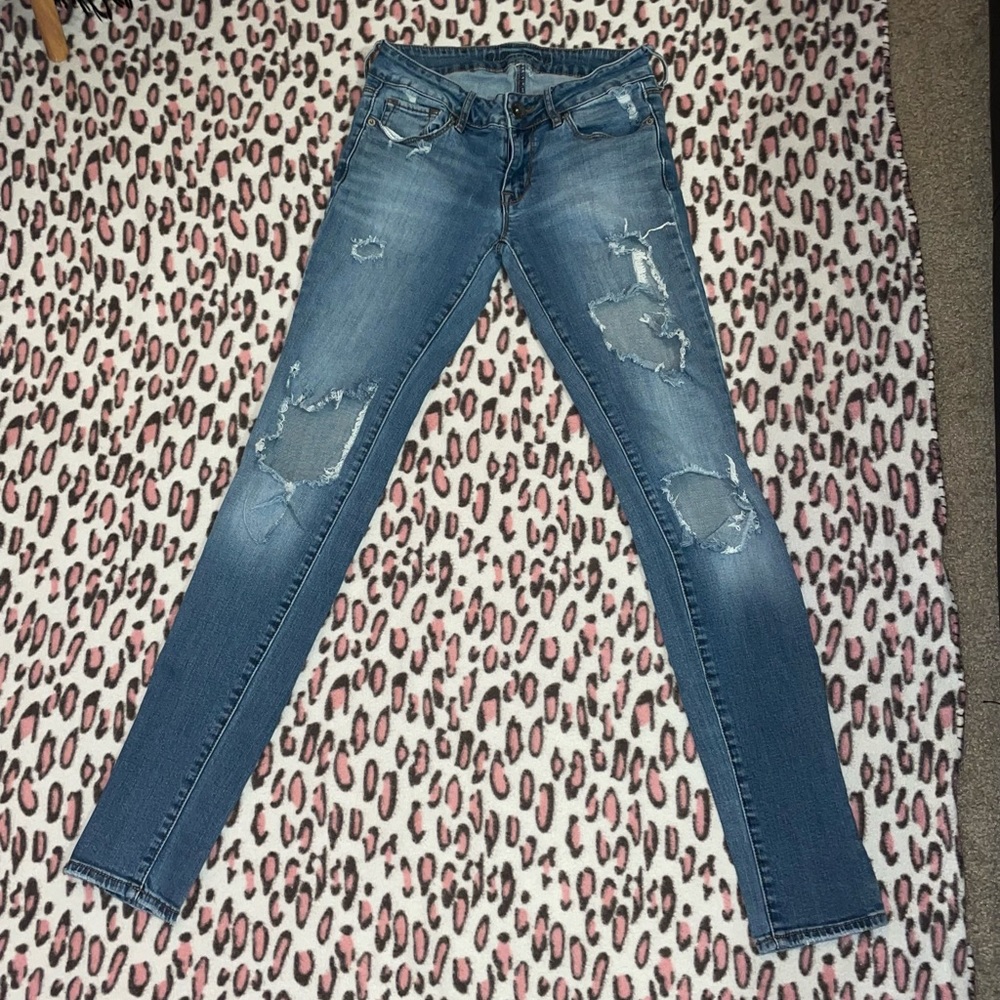 Distressed dark wash jeans